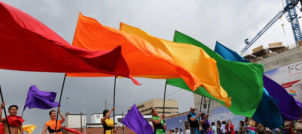 pride flags in parade cropped
