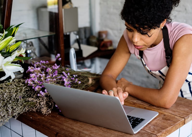 Woman running a small business via laptop