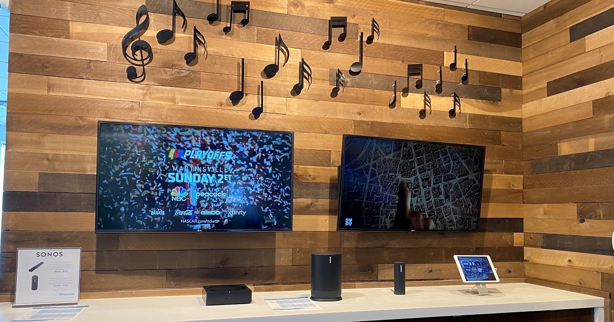 A display of Sonos speakers in an altafiber retail store.